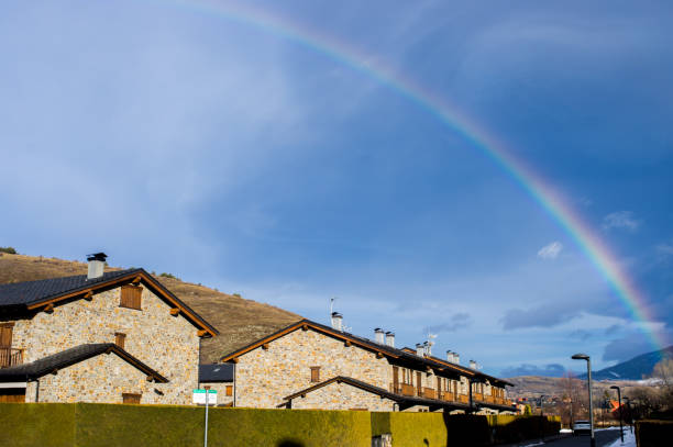 Rainbow over the village in Llivia, Girona, Catalonia, Spain llivia stock pictures, royalty-free photos & images