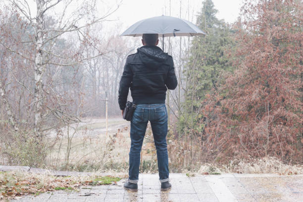 Carrying opened umbrella. Photo is taken with full frame dslr camera.