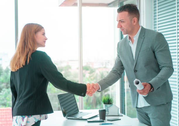istock business woman with confidence handshake with partner 1079760056