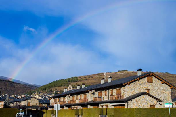 Rainbow over the village in Llivia, Girona, Catalonia, Spain llivia stock pictures, royalty-free photos & images