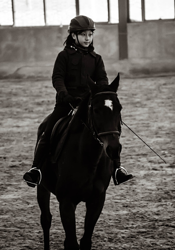 Asian Girl Horseback Riding At Ranch