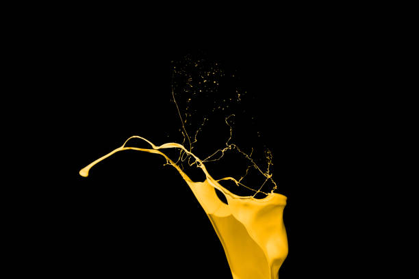 istock Yellow paint splash isolated on black background. 1079764520