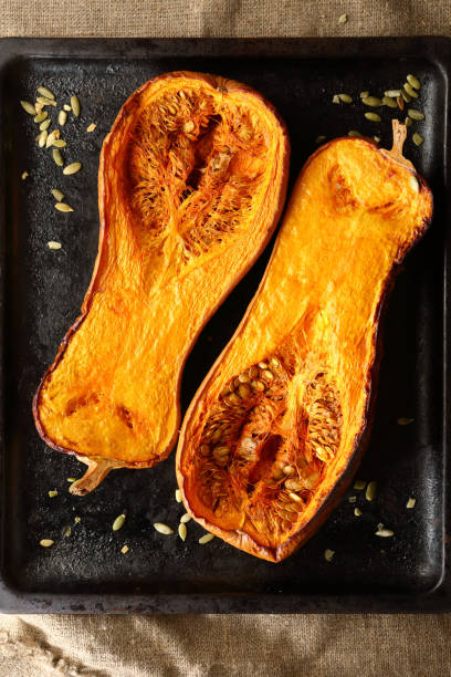 istock Two halves of baked pumpkins 1079773046