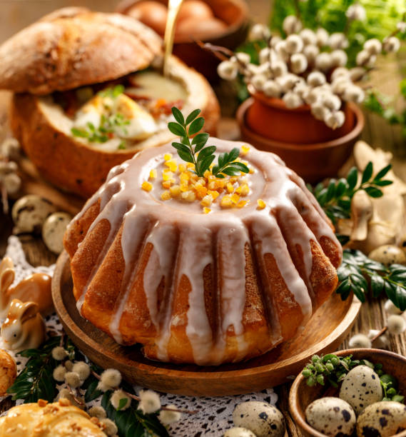 Easter yeast cake with icing and candied orange peel, delicious Easter dessert Easter yeast cake with icing and candied orange peel, delicious Easter dessert, traditional Easter pastries in Poland easter cake stock pictures, royalty-free photos & images