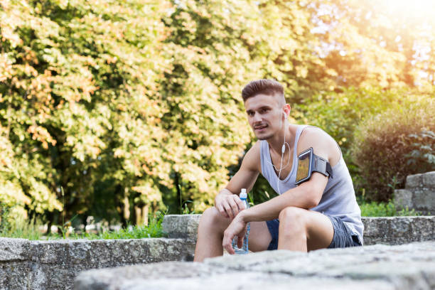istock Young sportsman having rest time after training. 1079775622