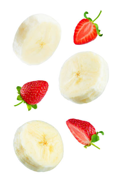 istock Flying banana slices with strawberries on a white background 1079776368