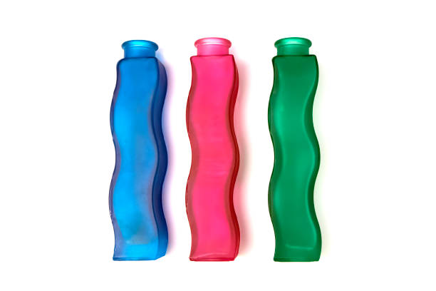 Three wavy glass flower vases of different colors