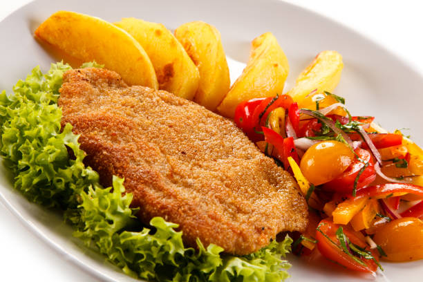 istock Fried pork chop, boiled potatoes and vegetables 1079781766