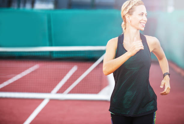 istock Sportswoman during jogging on a run track 1079781838