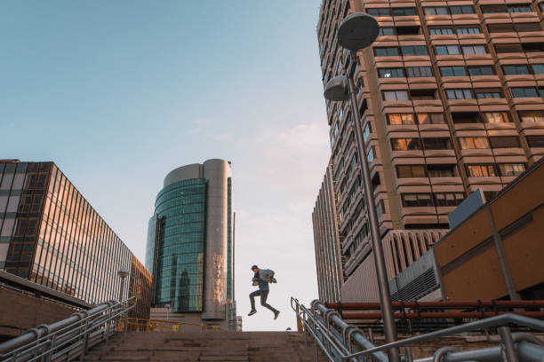 istock Young man taking a big jump 1079782024
