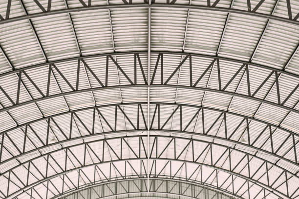 istock Pattern of steel roof framework, Curve roof steel design structure with galvanized corrugated roofing tile steel sheet. 1079783780