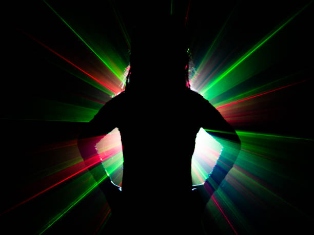 istock silhouette of woman dancing on abstract background 1079785800