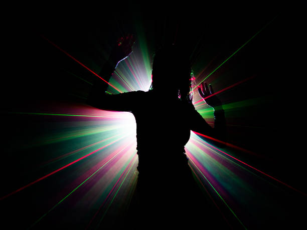 istock silhouette of woman dancing on abstract background 1079785956