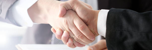 istock Man in suit shake hand as hello in office 1079786512