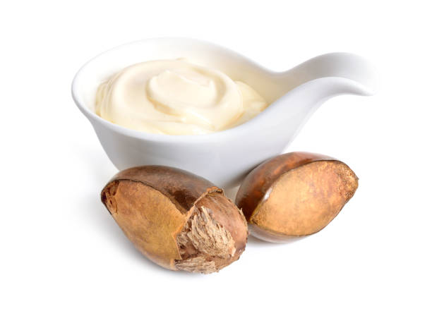 istock Shea nuts with butter or cream in the bowl. Isolated on white ba 1079786944