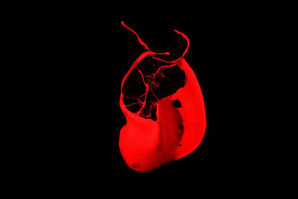 istock Red paint splash isolated on black background. 1079787260
