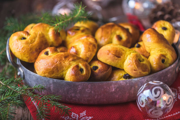 a tray of freshly baked homemade swedish traditional saffron buns - buns of steel imagens e fotografias de stock