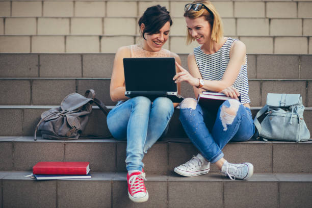 istock College girls using laptop 1079791046