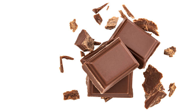 istock Milk chocolate pieces isolated on white background from top view 1079803308