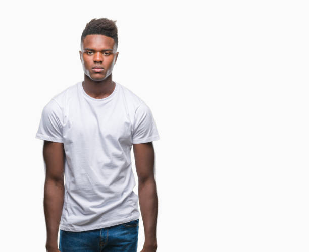 istock Young african american man over isolated background with serious expression on face. Simple and natural looking at the camera. 1079822814