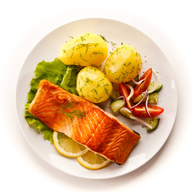 Grilled salmon with boiled potatoes and vegetable salad