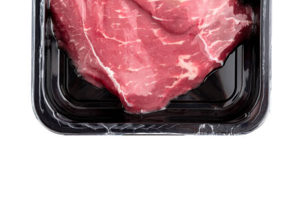 istock Vacuum-packed beef on a white background. Marbled beef from the store isolated on a white background. 1079825576