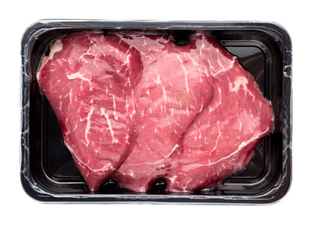 istock Vacuum-packed beef on a white background. Marbled beef from the store isolated on a white background. 1079825606