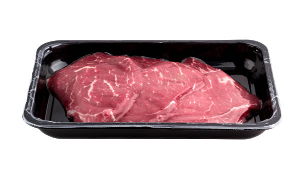 istock Vacuum-packed beef on a white background. Marbled beef from the store isolated on a white background. 1079825702