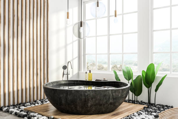 istock Black round bathtub in loft bathroom 1079828568