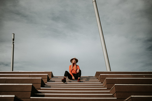 Young woman on modern staircase