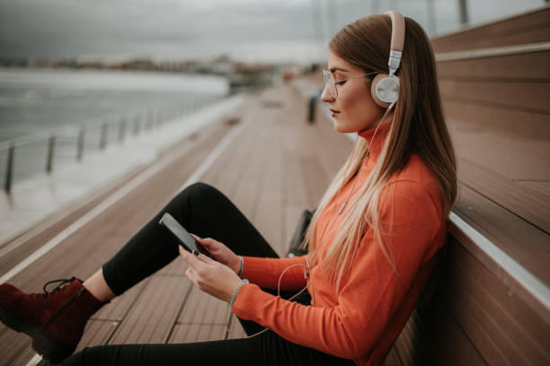 istock Young woman with headphones 1079833368