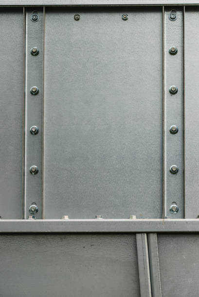 istock Screw caps on a metal steel wall. 1079834236