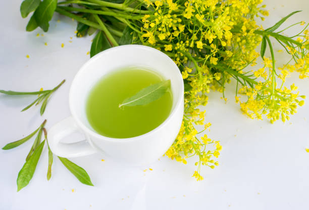 istock Green Tea and Blooming Spring Flowers 1079836438