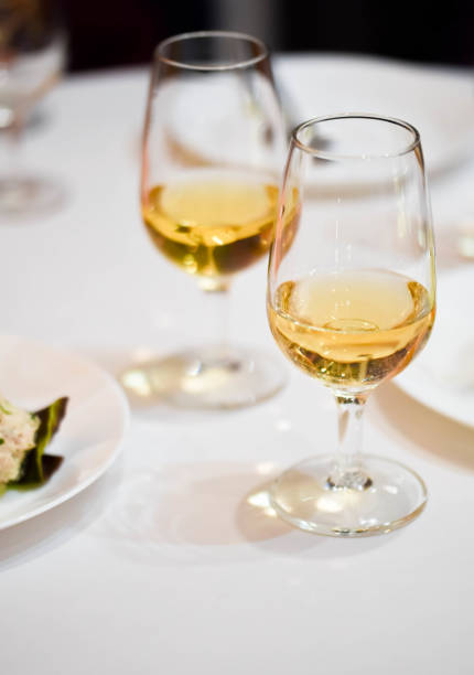 istock Two wine glasses with sparkling orange wine on a restaurant table, ready for a degustation 1079838596