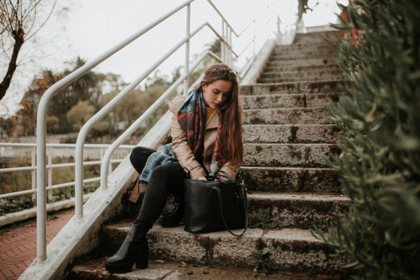 Young woman searching on her bag
