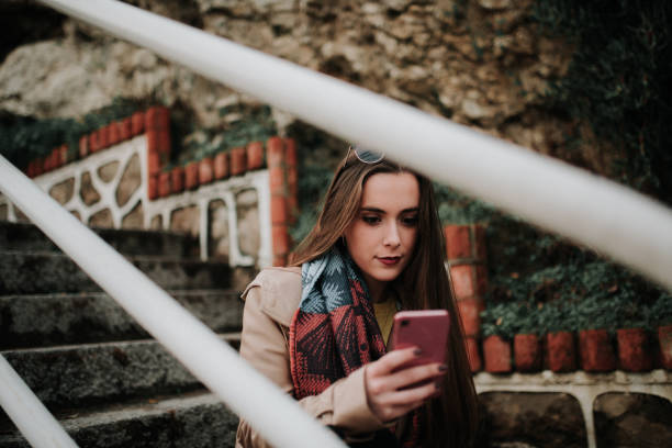istock Young woman using a smartphone 1079839836