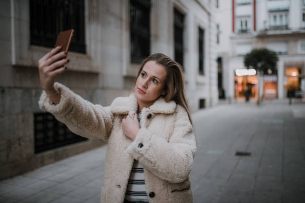 istock Young woman taking her selfie picture 1079841554