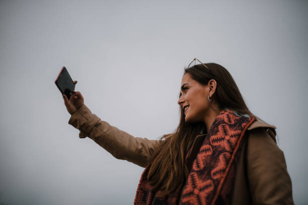 istock Young woman taking her selfie picture 1079841598