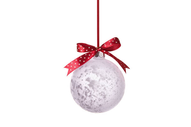 istock Christmas ball with red spotted ribbon. Isolated on white background. 1079842070