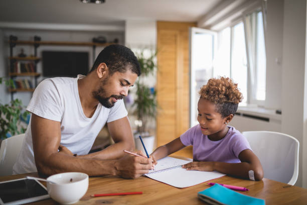 istock Father and daughter doing homework in the morning 1079842706