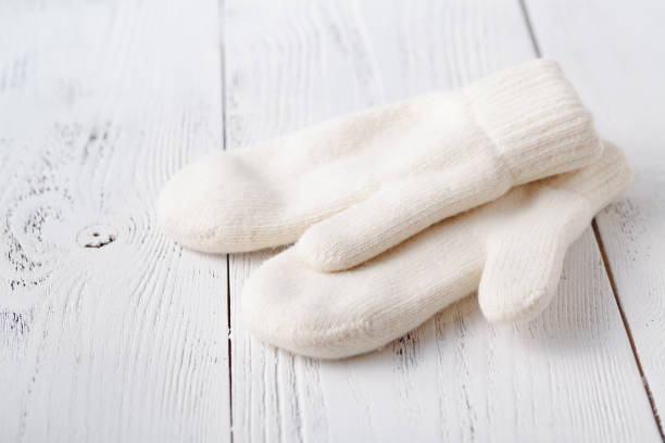 istock White women's knitted mittens 1079847188