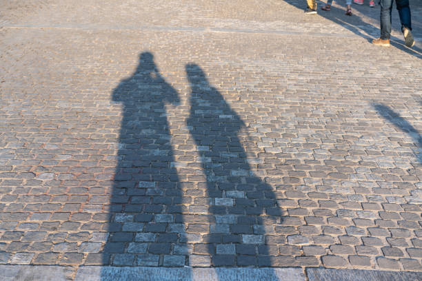 istock Shadow of two lovers on the ground 1079855092