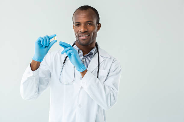 istock Positive afro american doctor advising vitamins 1079855974