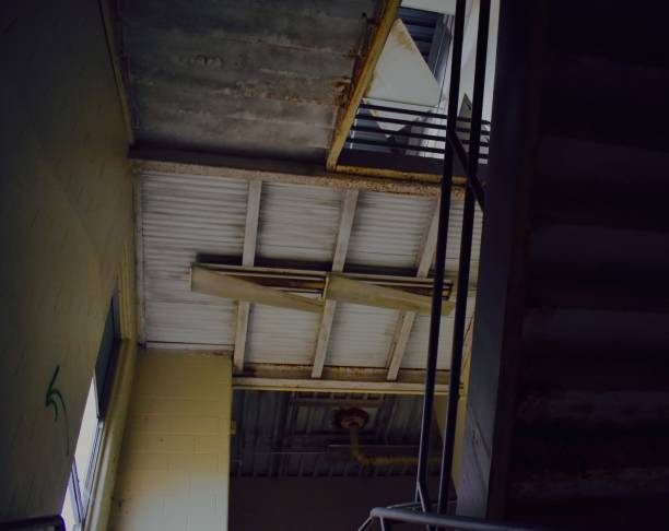 istock Stairwell of empty school forming an abstract, colorful, backgroun pattern with texture. 1079859444