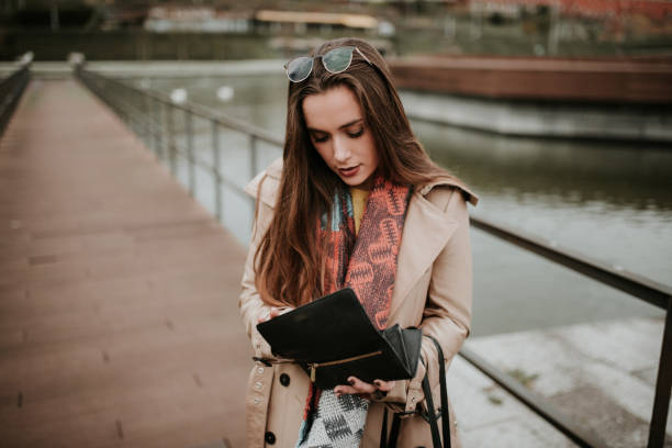 istock Young woman checking her wallet 1079860074