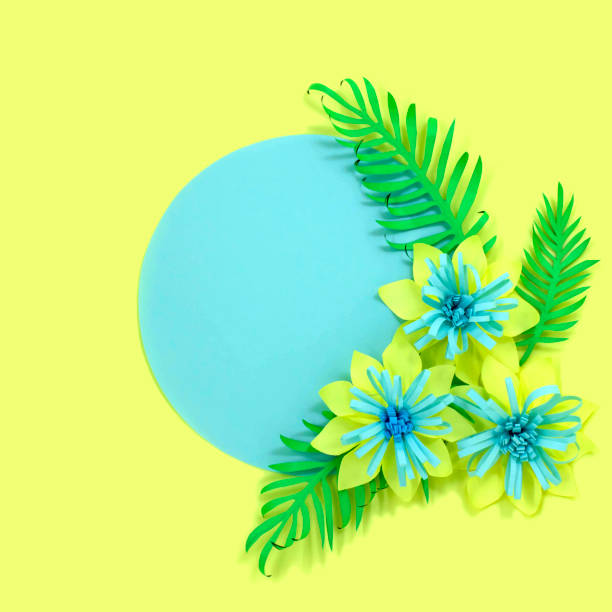 istock Tropical paper flowers on pastel blue circle 1079867094