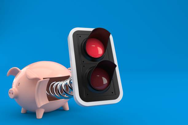istock Red traffic light with piggy bank 1079872246