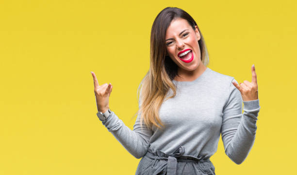 istock Young beautiful worker business woman over isolated background shouting with crazy expression doing rock symbol with hands up. Music star. Heavy concept. 1079882474