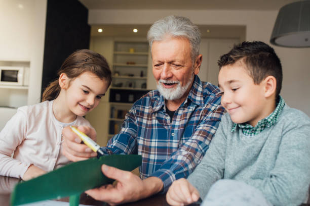 istock Happy man making a toy for grandchildren 1079886224