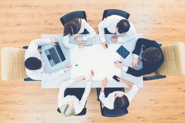 istock The business people work with a blank sheet on the table. view from above 1079904972
